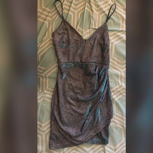 tight dark blue dress full of glitter in a size small
